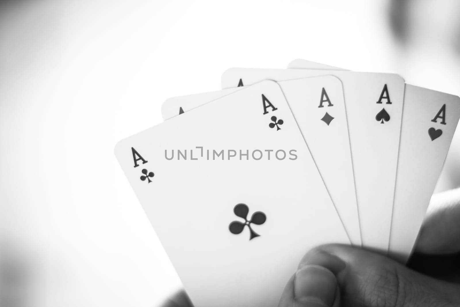 Young man is playing cards, cutout of his hands