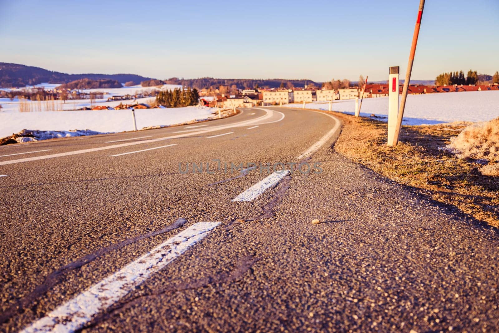 Black rough asphalt road in Austria, closeup