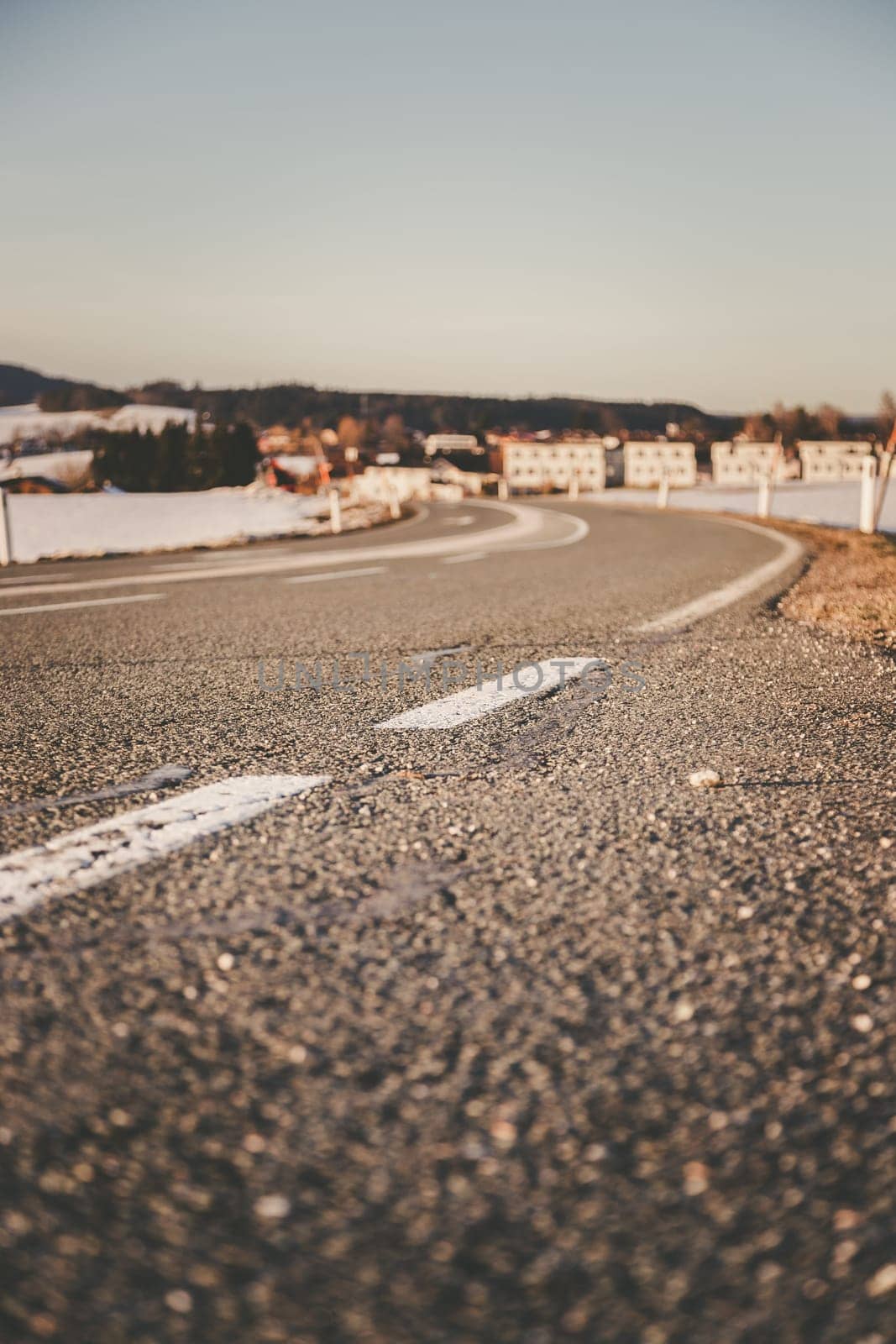 Black rough asphalt road in Austria, closeup