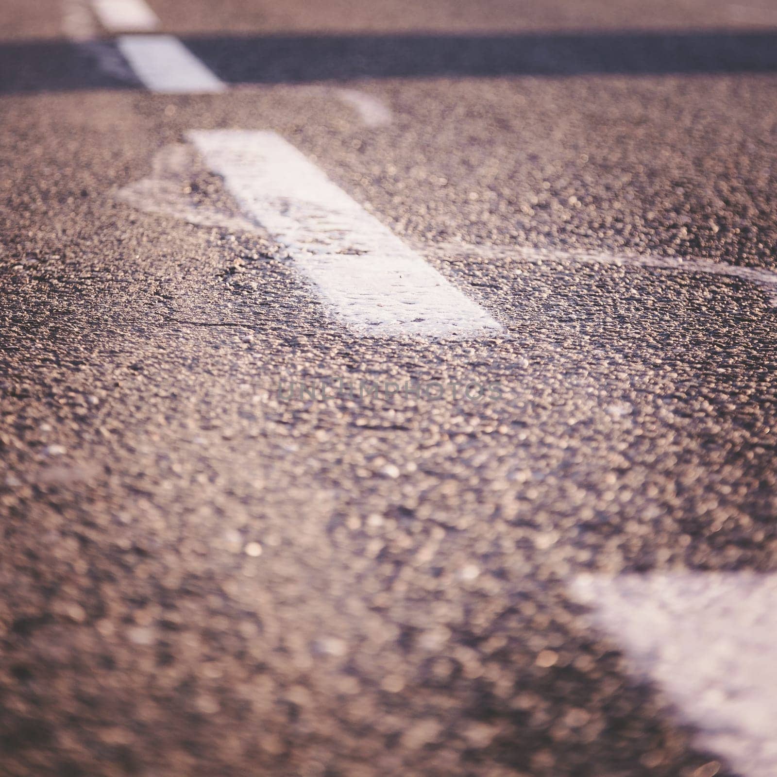 Black rough asphalt road in Austria, closeup