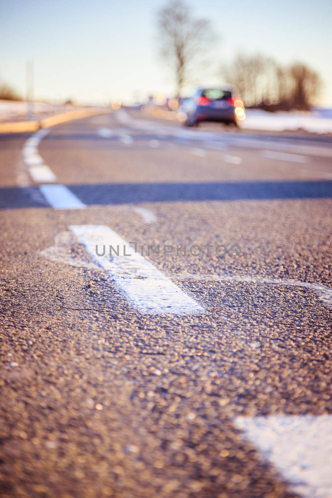 Black rough asphalt road in Austria, closeup