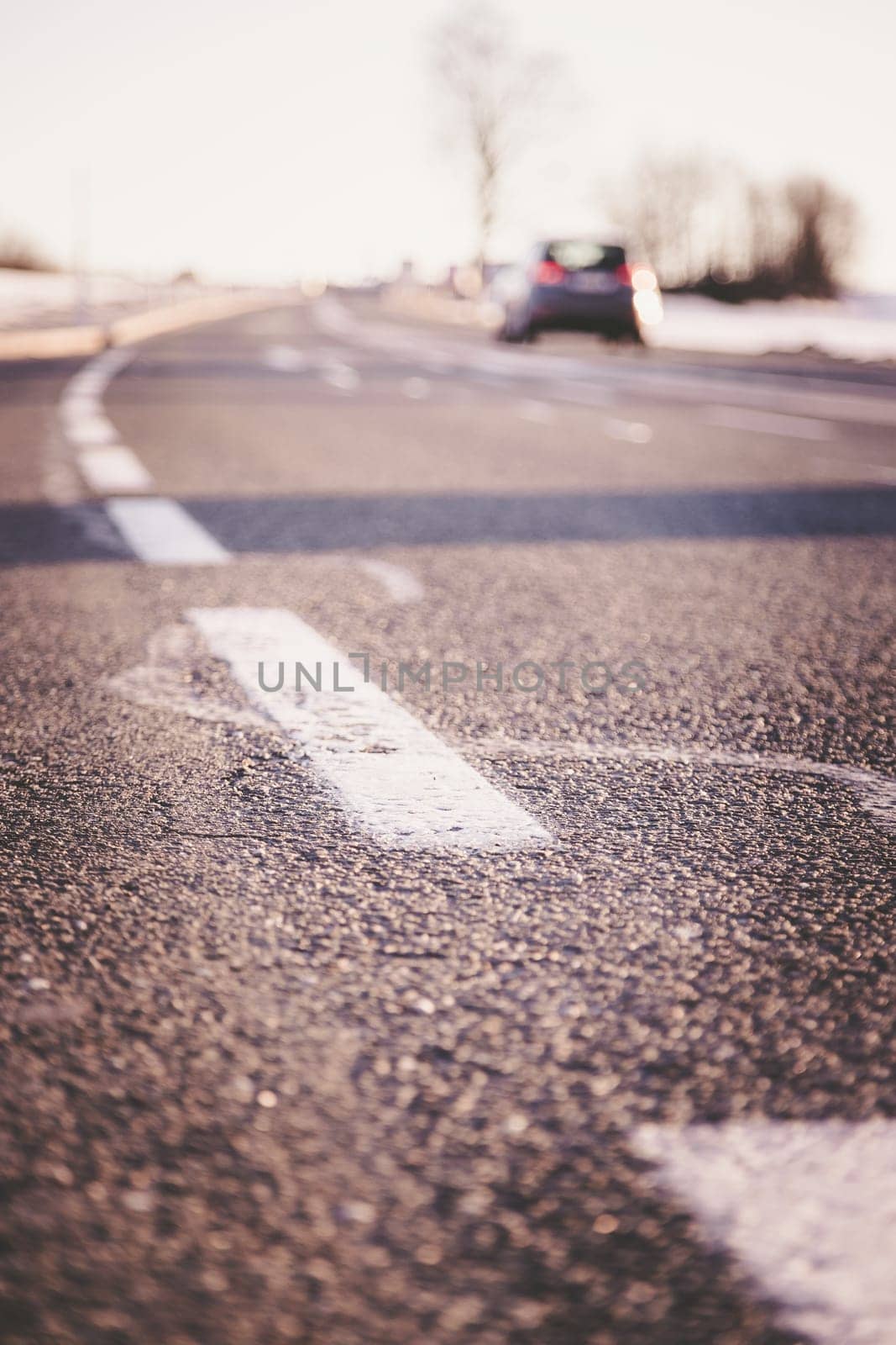 Black rough asphalt road in Austria, closeup