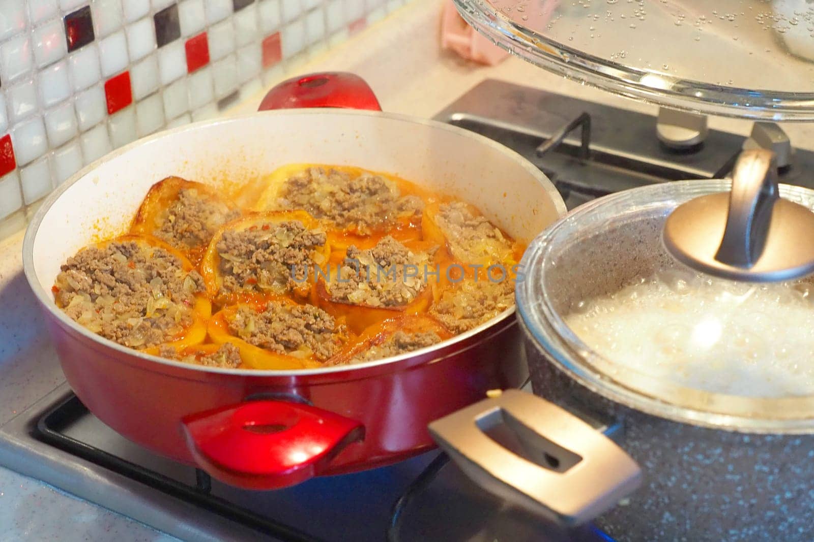 Preparing food for iftar in Ramadan, home cooking on the stove