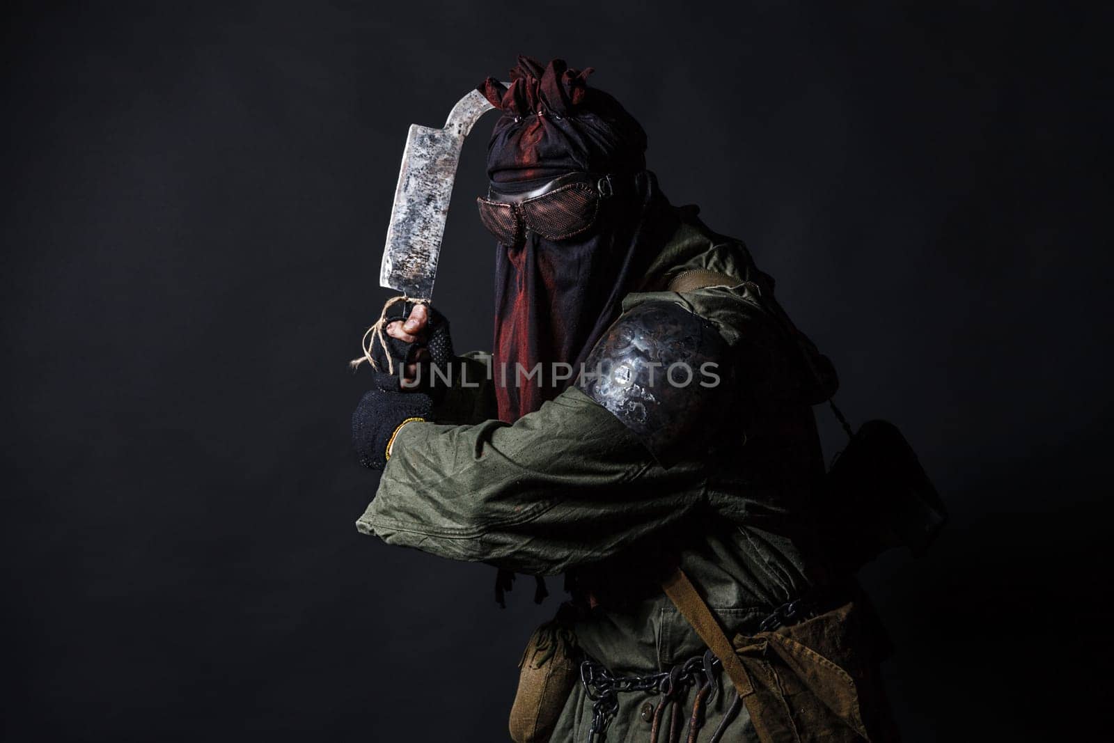Nuclear post apocalypse. Studio shot of survivor in tatters