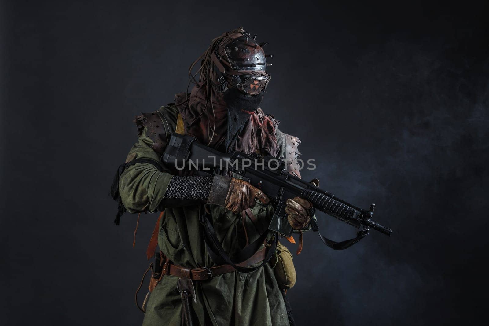 Nuclear post apocalypse. Studio shot of survivor in tatters