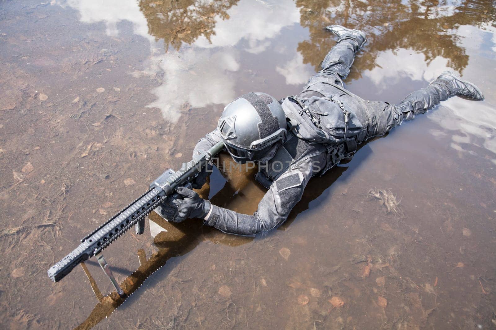 Spec ops police officer SWAT in action in the water