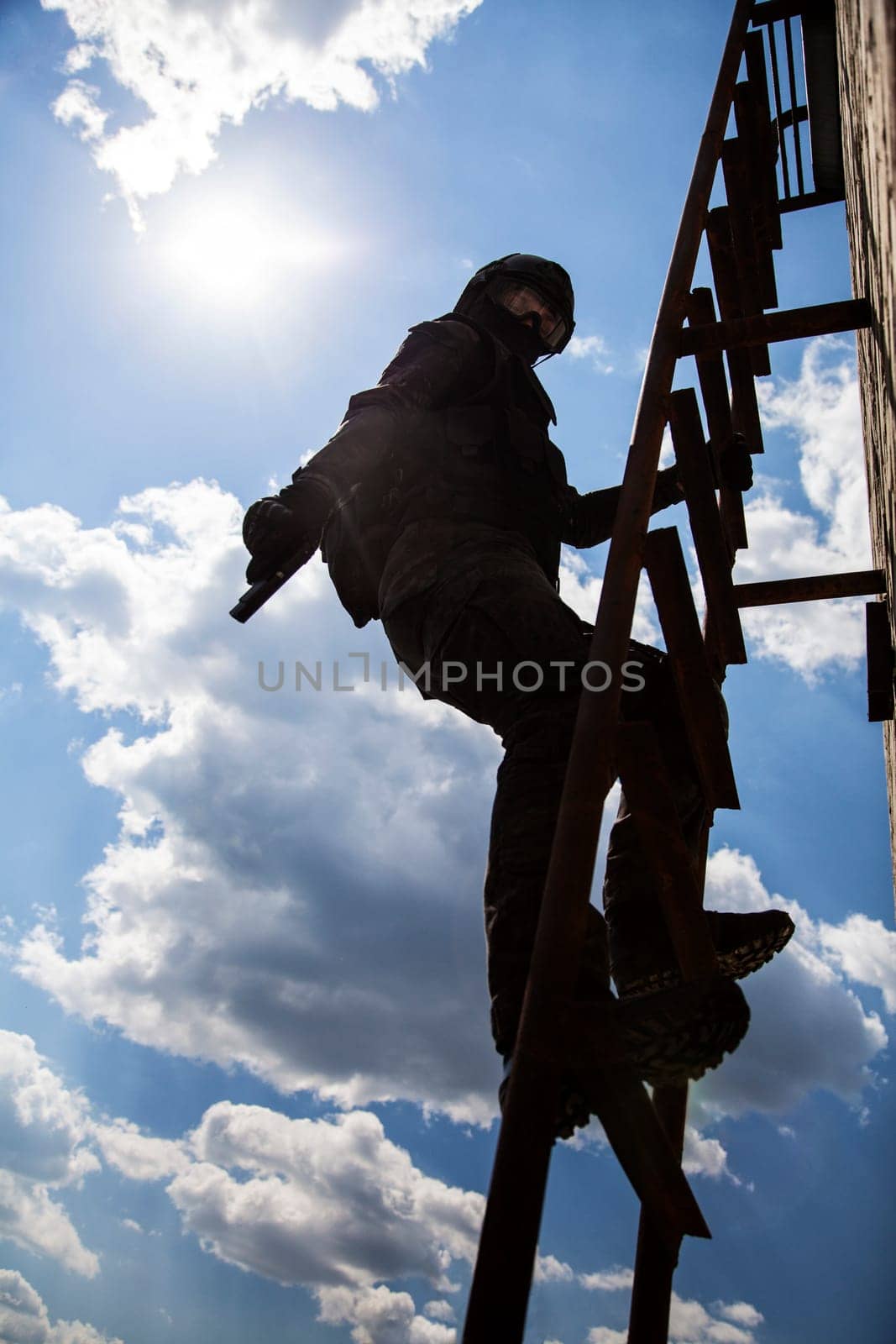 Spec ops police officer SWAT in black uniform in action