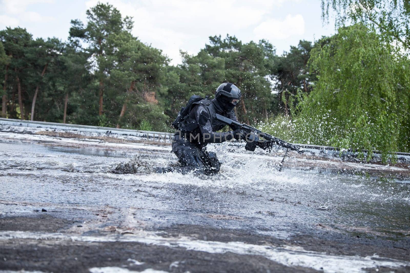 Spec ops police officer SWAT in action in the water