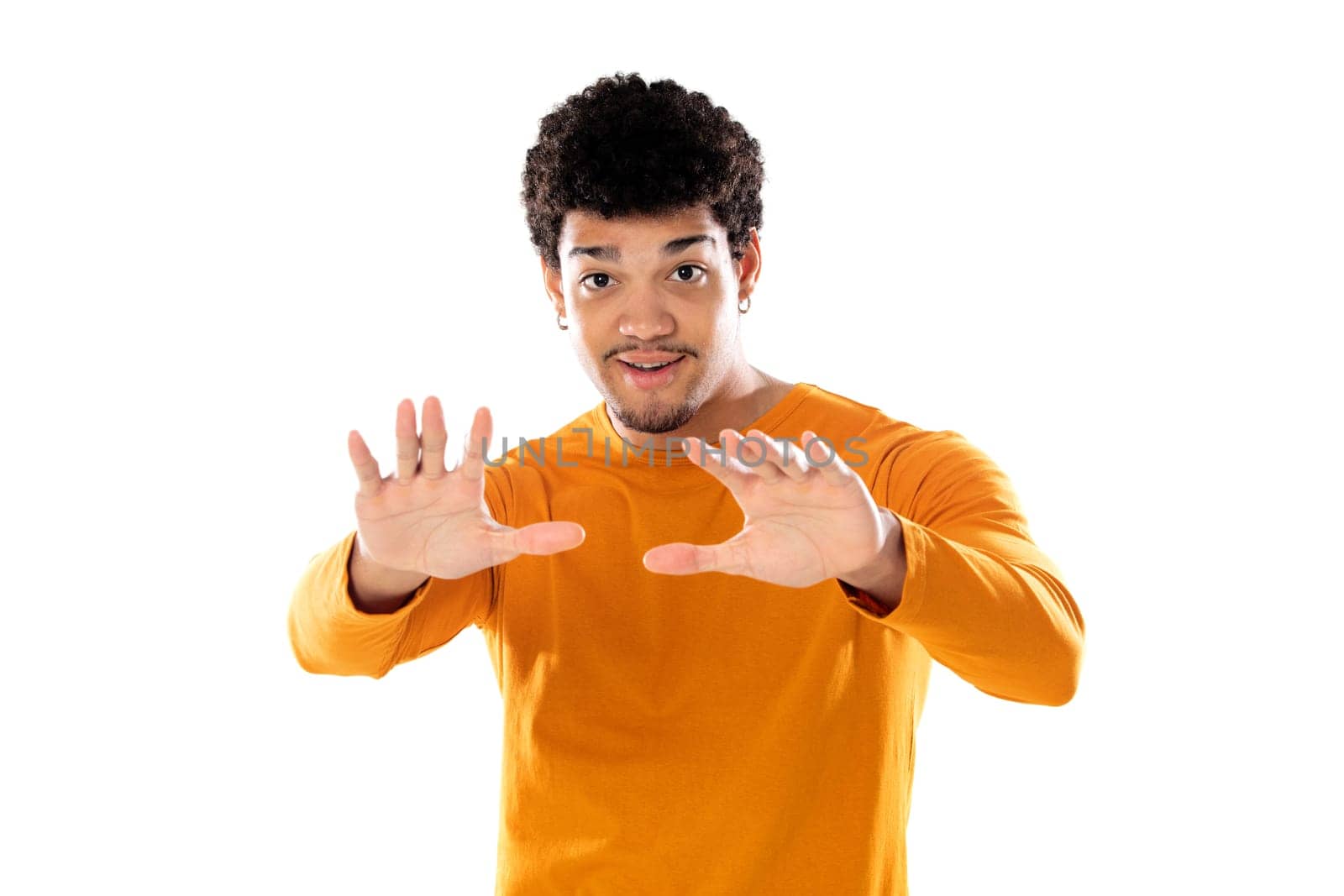 Cute african american man with afro hairstyle wearing a orange T-shirt isolated on a white background