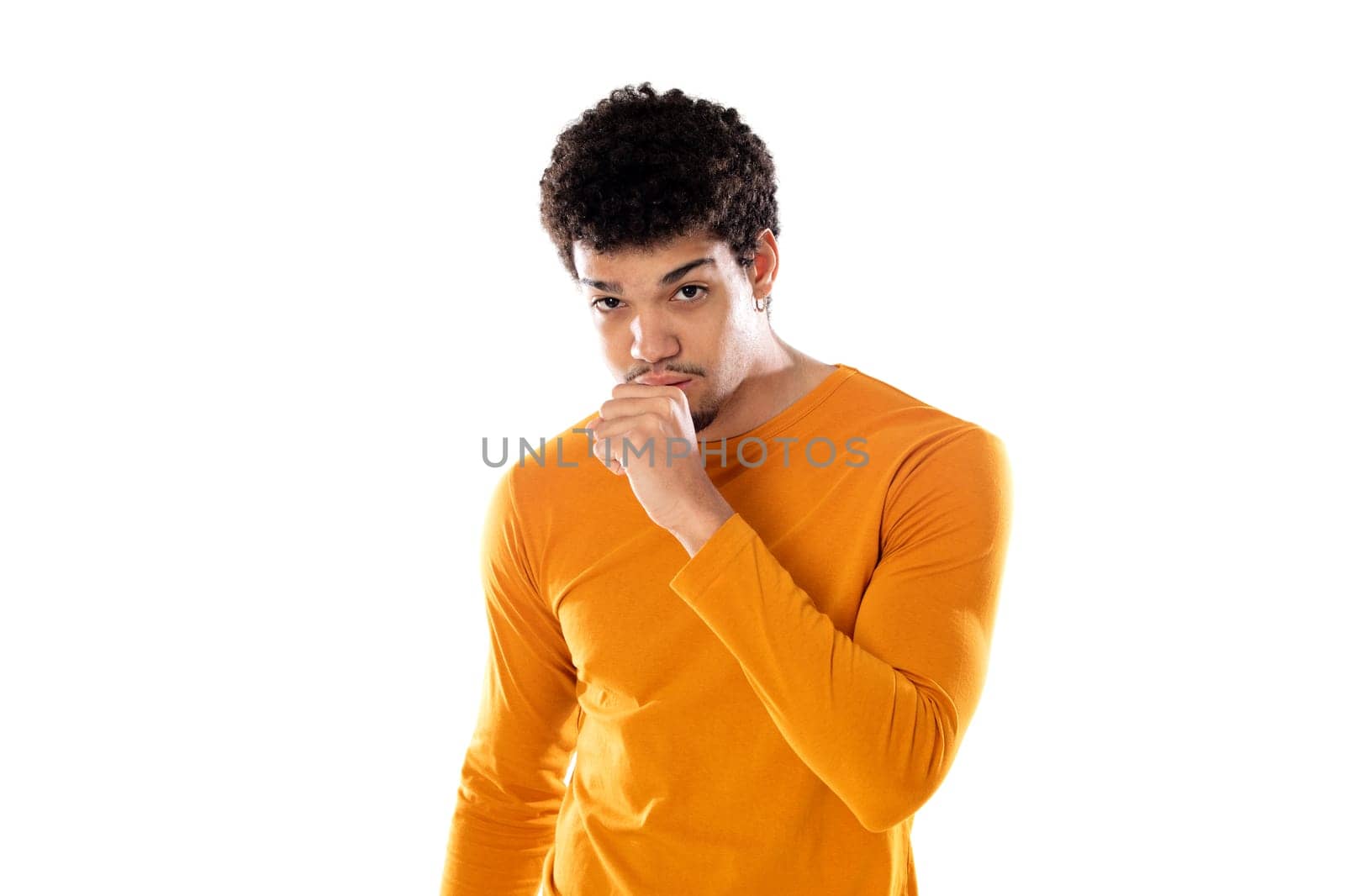 Cute african american man with afro hairstyle wearing a orange T-shirt isolated on a white background