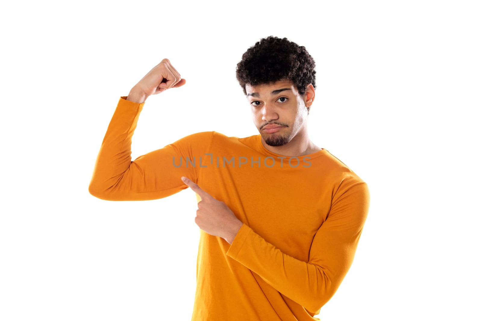 Young african american black man feeling happy, satisfied and powerful, flexing fit and muscular biceps, looking strong after the gym against isolated background