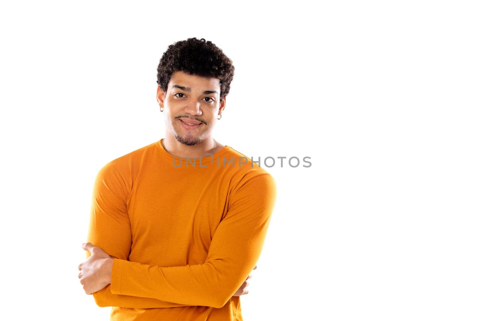 Smiling young man with afro hair wearing orange sweater isolated on a white background