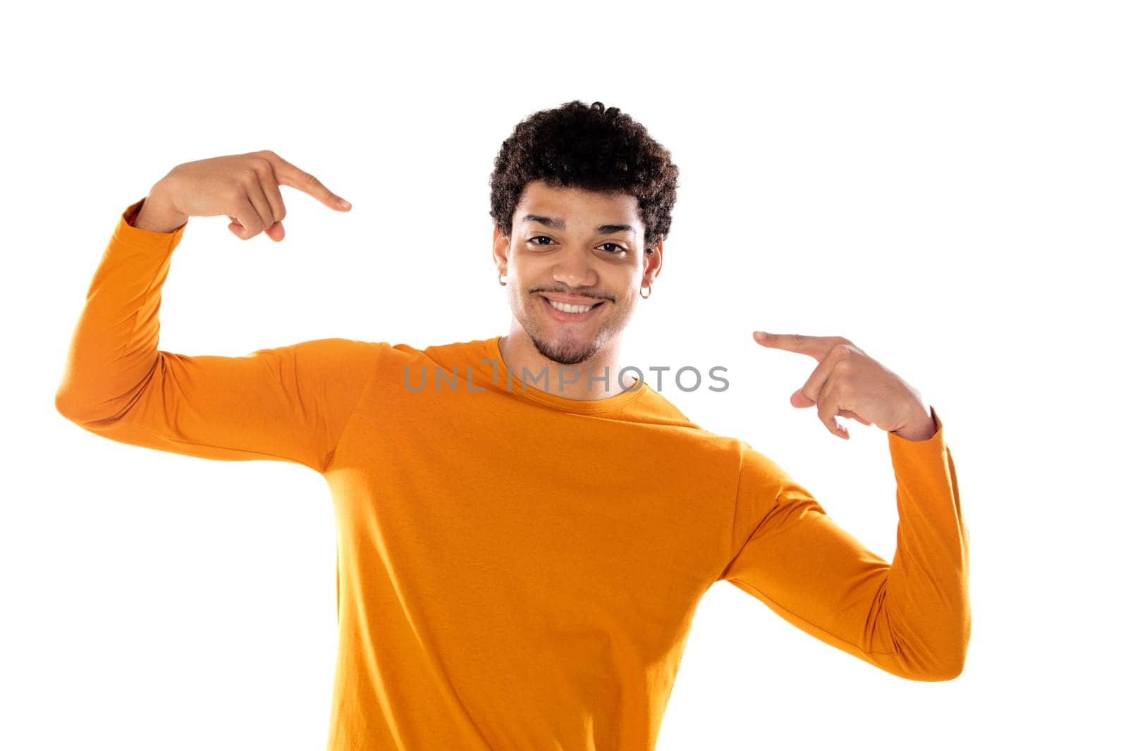 Young black afro guy laughing and pointing to something with his finger isolated on a white background
