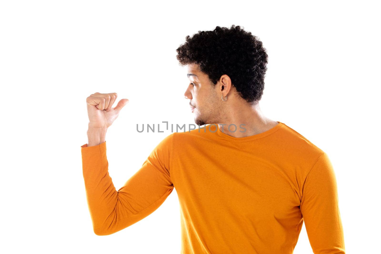 Young african american black man feeling happy, satisfied and powerful, flexing fit and muscular biceps, looking strong after the gym against isolated background