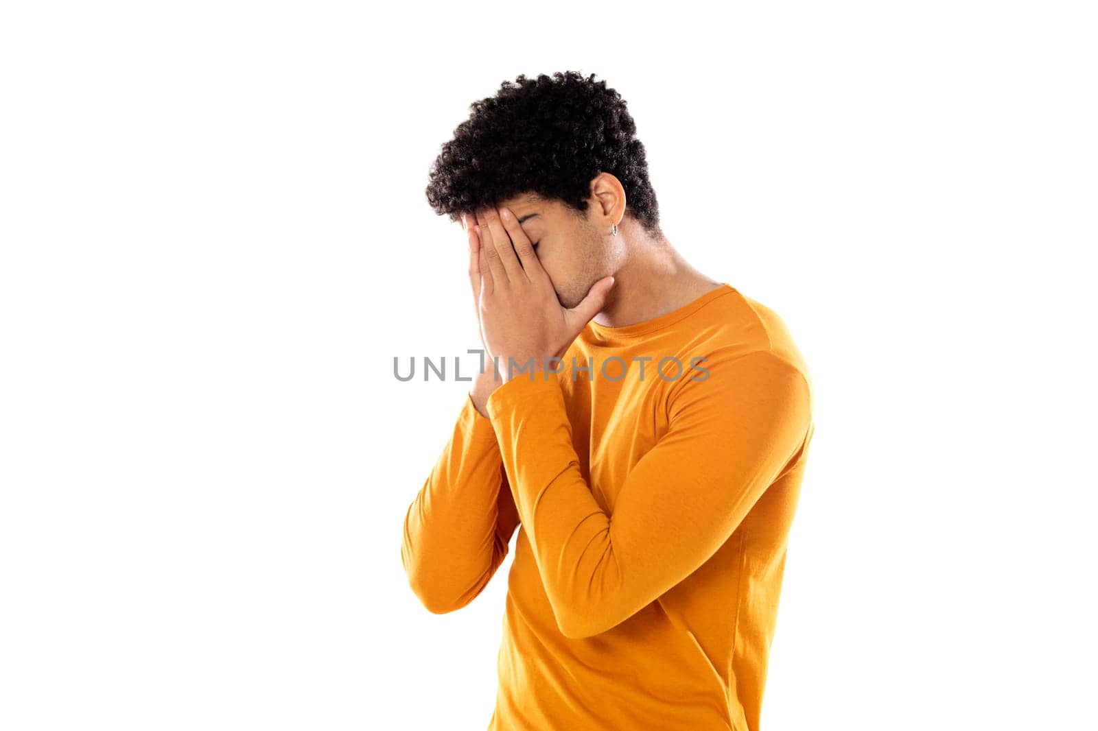 Cute african american man with afro hairstyle wearing a orange T-shirt isolated on a white background