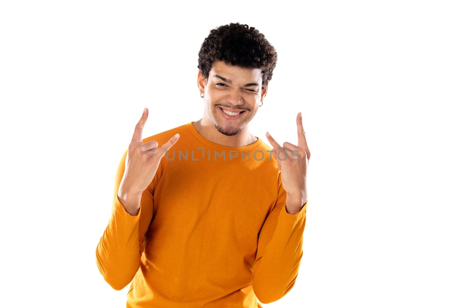 Young afro guy showing rock gesture with fingers isolated on a white background