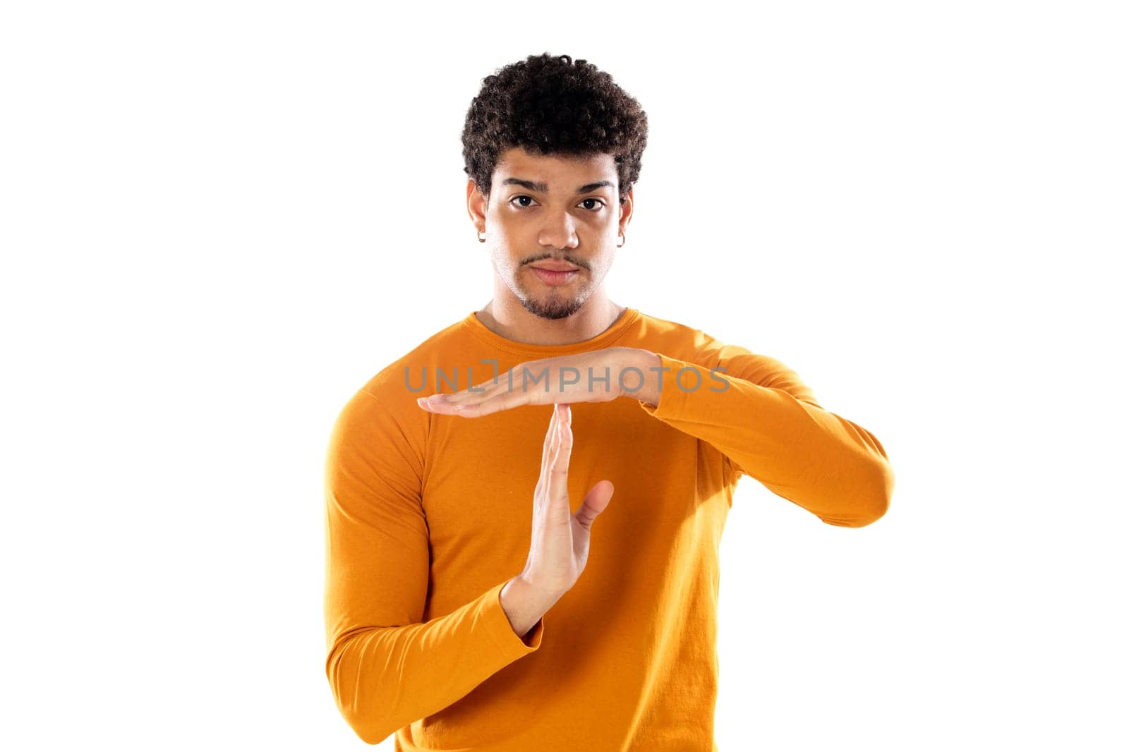Cute african american man with afro hairstyle wearing a orange T-shirt isolated on a white background