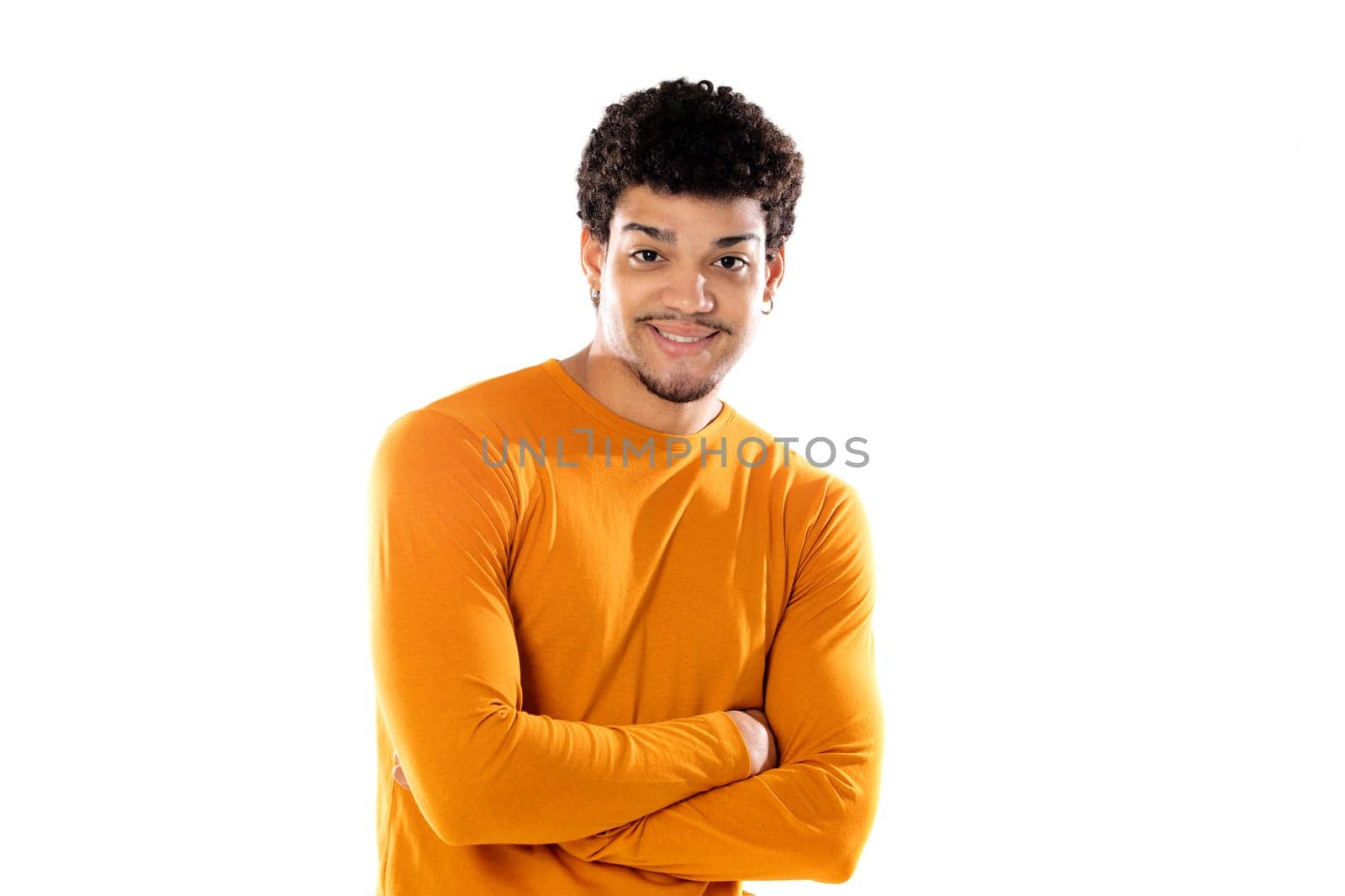 Smiling young man with afro hair wearing orange sweater isolated on a white background