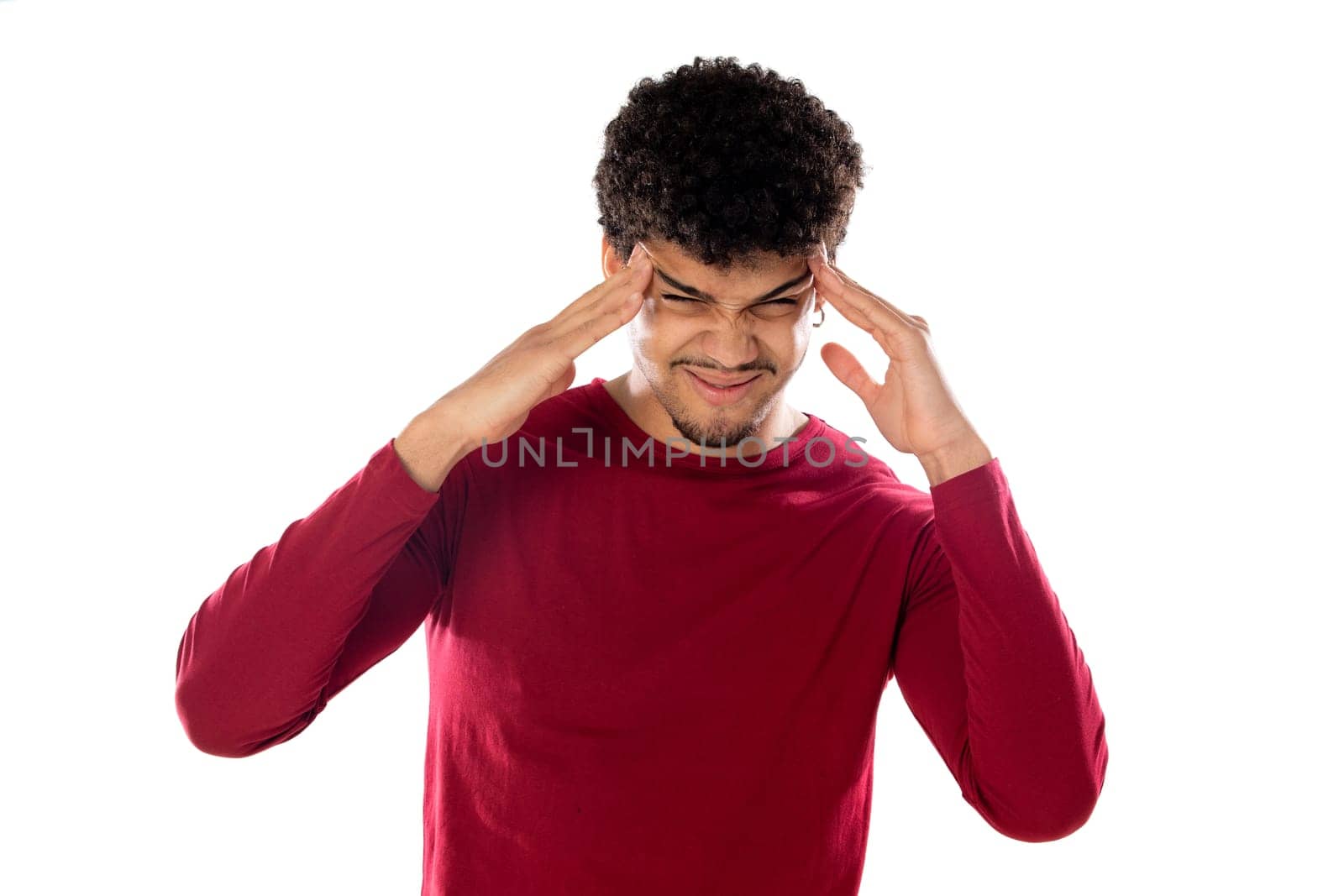 Cute african american man with afro hairstyle wearing a burgundy T-shirt isolated on a white background