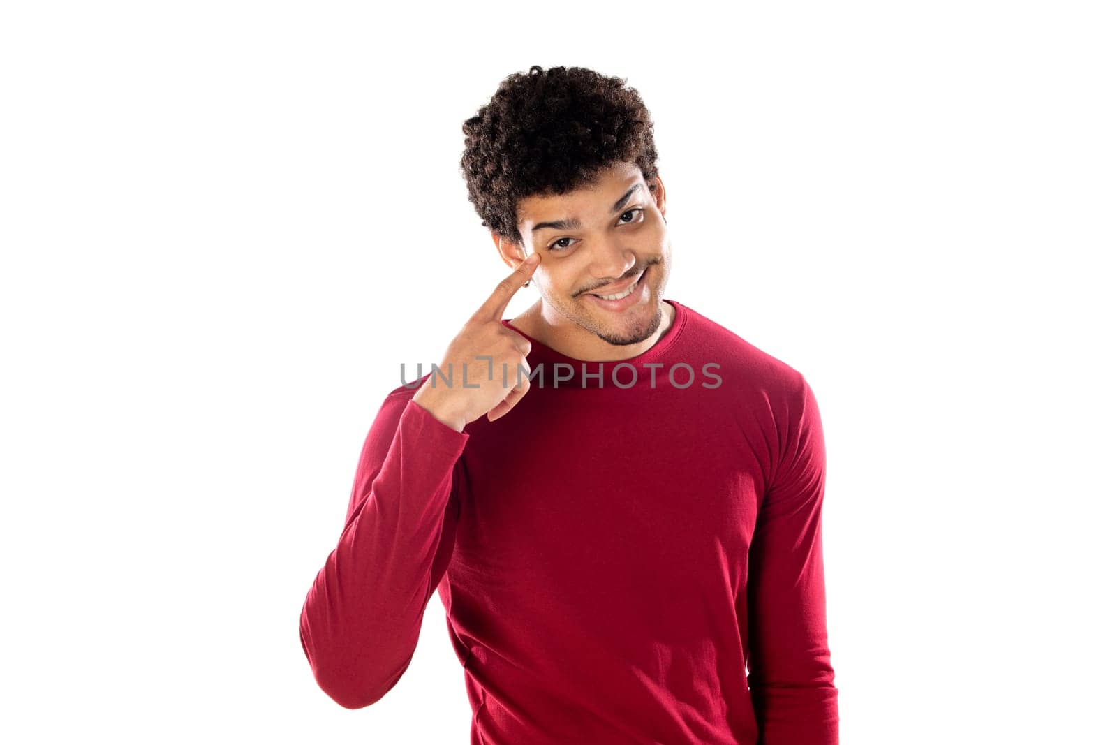 Cute african american man with afro hairstyle wearing a burgundy T-shirt isolated on a white background