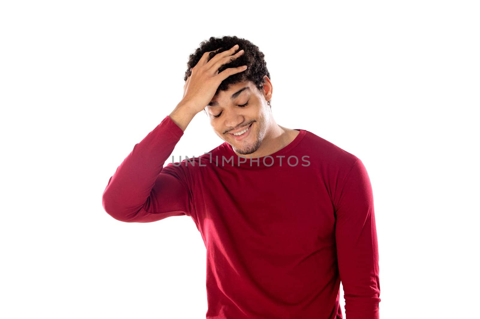 Cute african american man with afro hairstyle wearing a burgundy T-shirt isolated on a white background