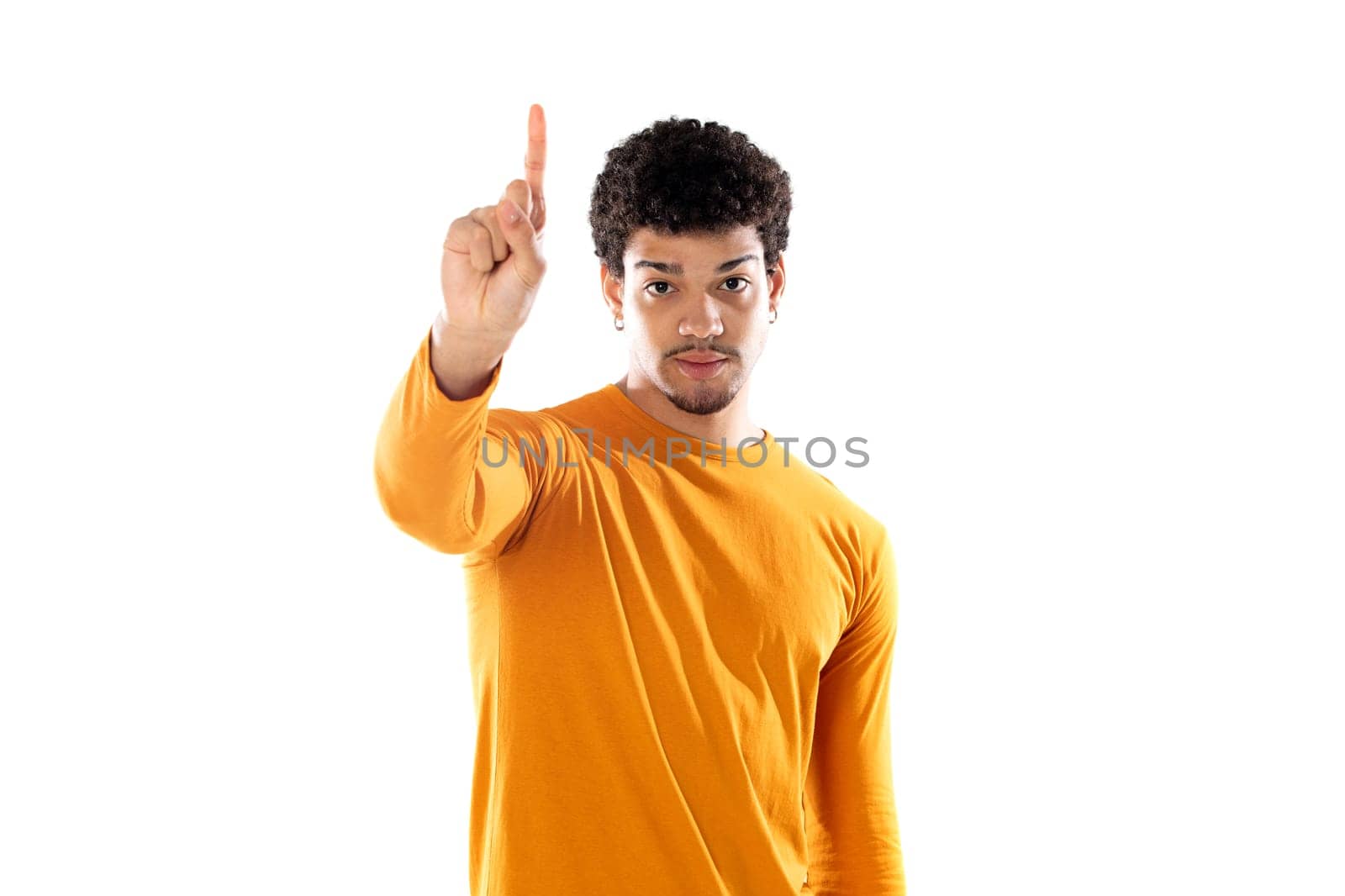 Cute african american man with afro hairstyle wearing a orange T-shirt isolated on a white background