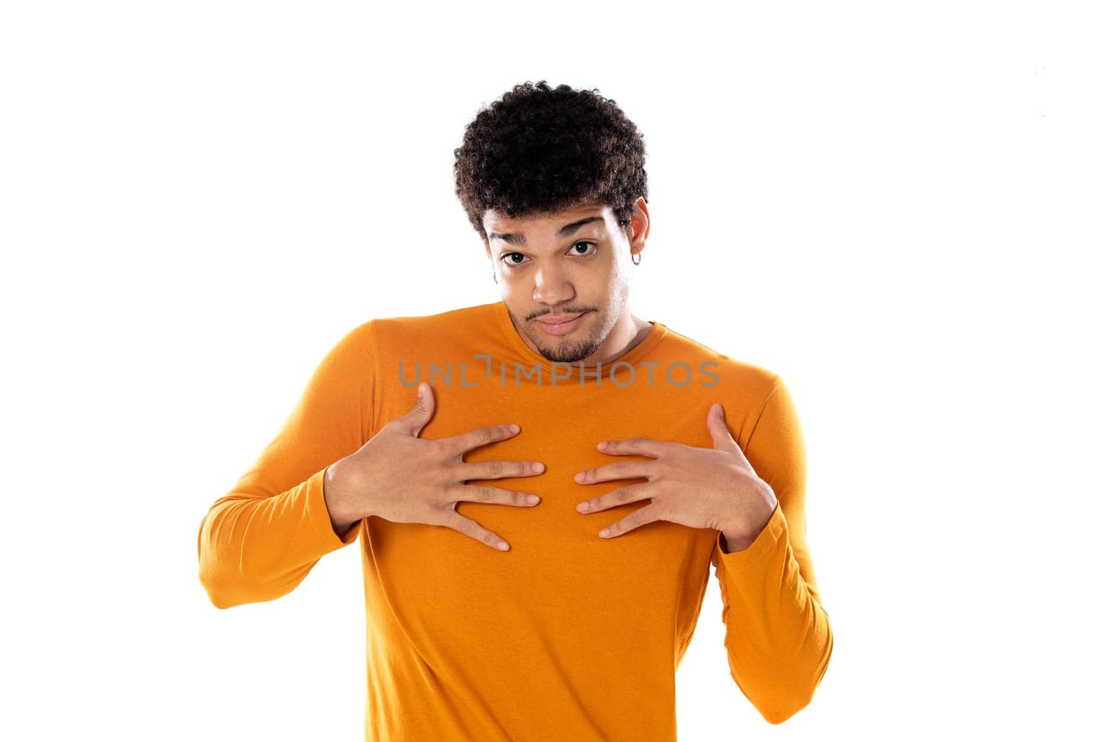 Puzzled afro guy wearing a orange sweater isolated on a white background