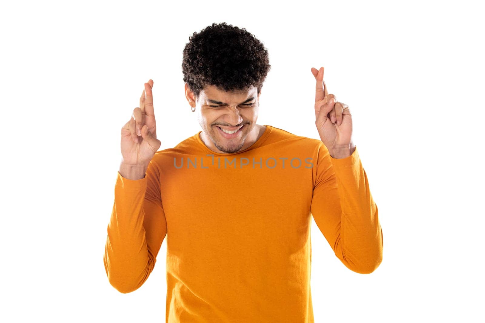 Cute african american man with afro hairstyle wearing a orange T-shirt isolated on a white background