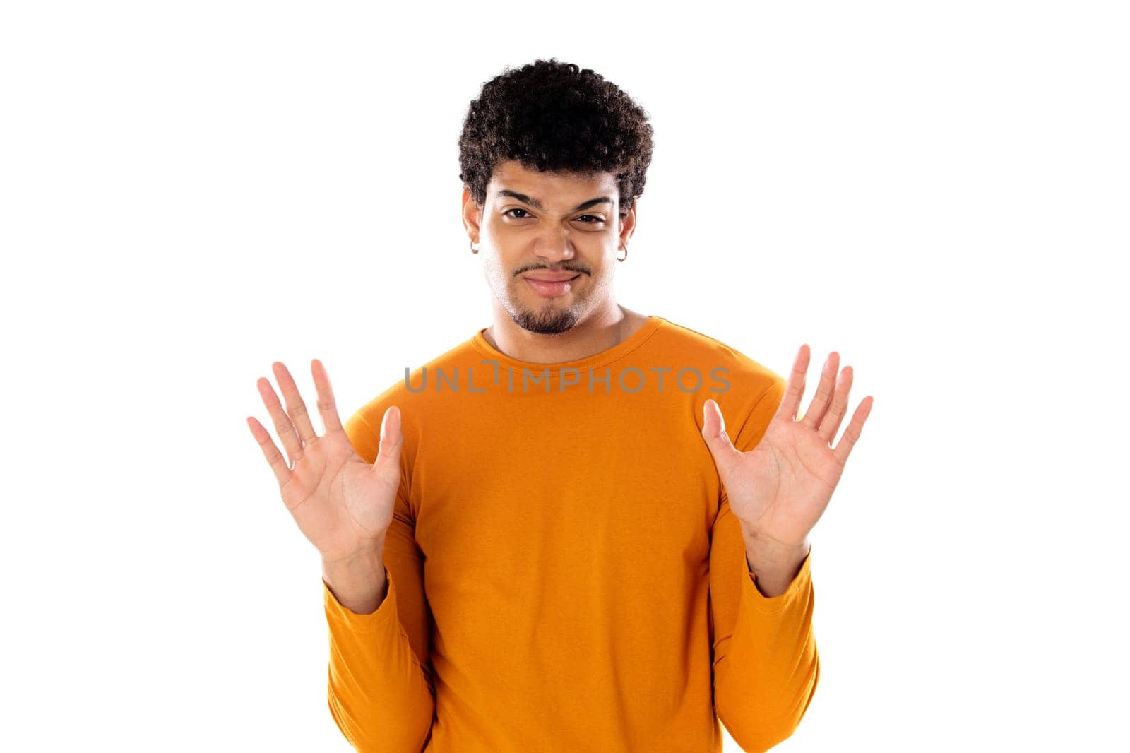Cute african american man with afro hairstyle wearing a orange T-shirt isolated on a white background