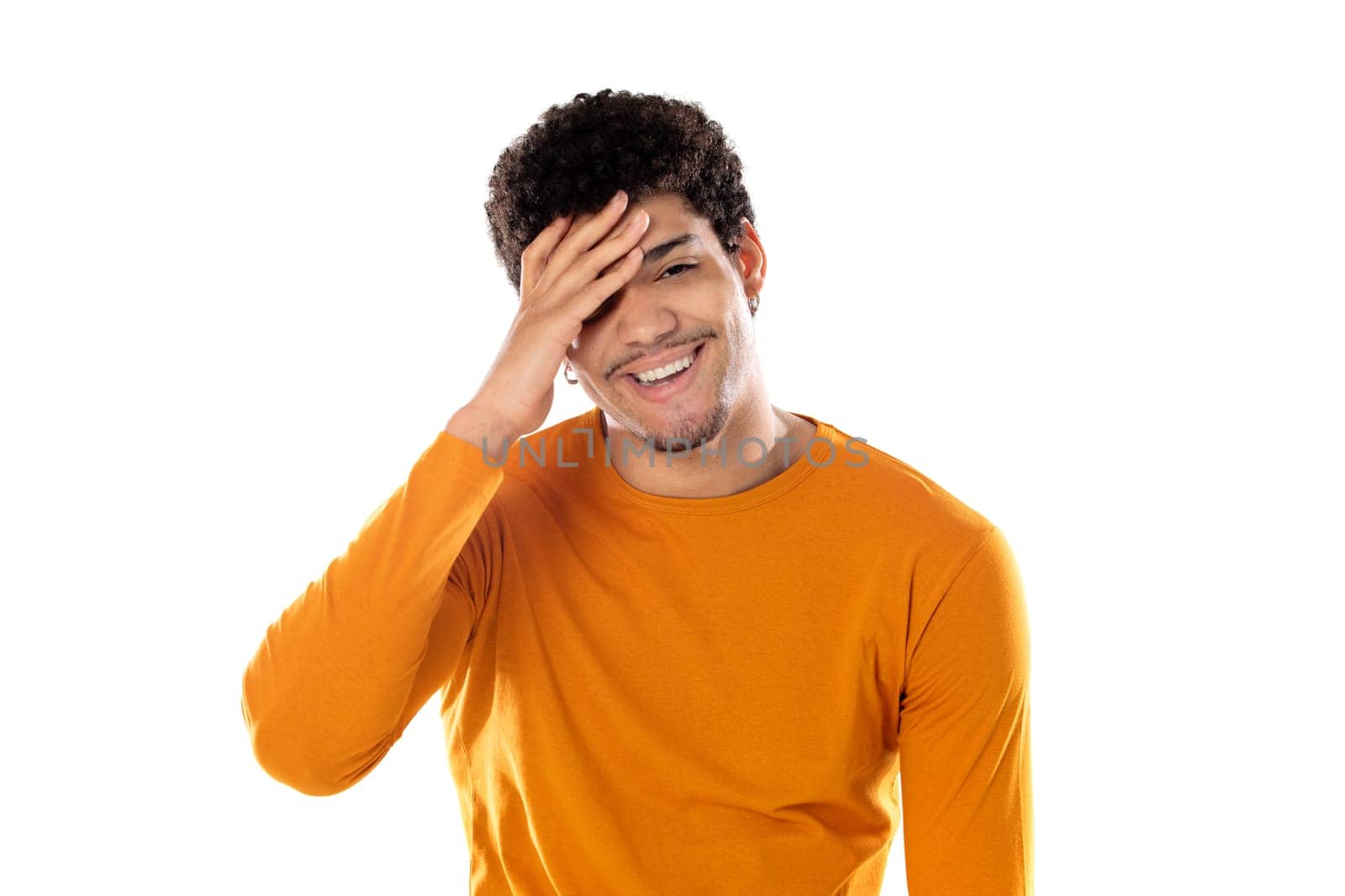 Young african american black man laughing out loud at some hilarious joke, feeling happy and cheerful, having fun isolated on a white background