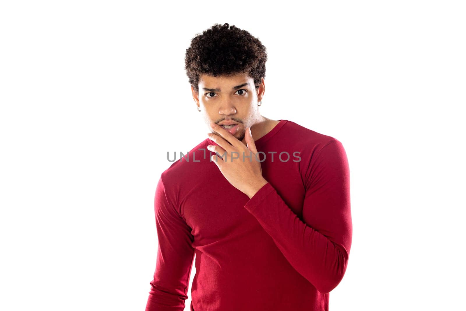 Cute african american man with afro hairstyle wearing a burgundy T-shirt isolated on a white background