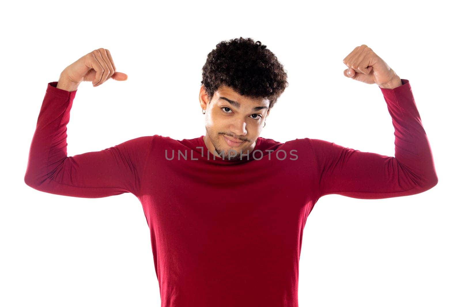 Cute african american man with afro hairstyle wearing a burgundy T-shirt isolated on a white background