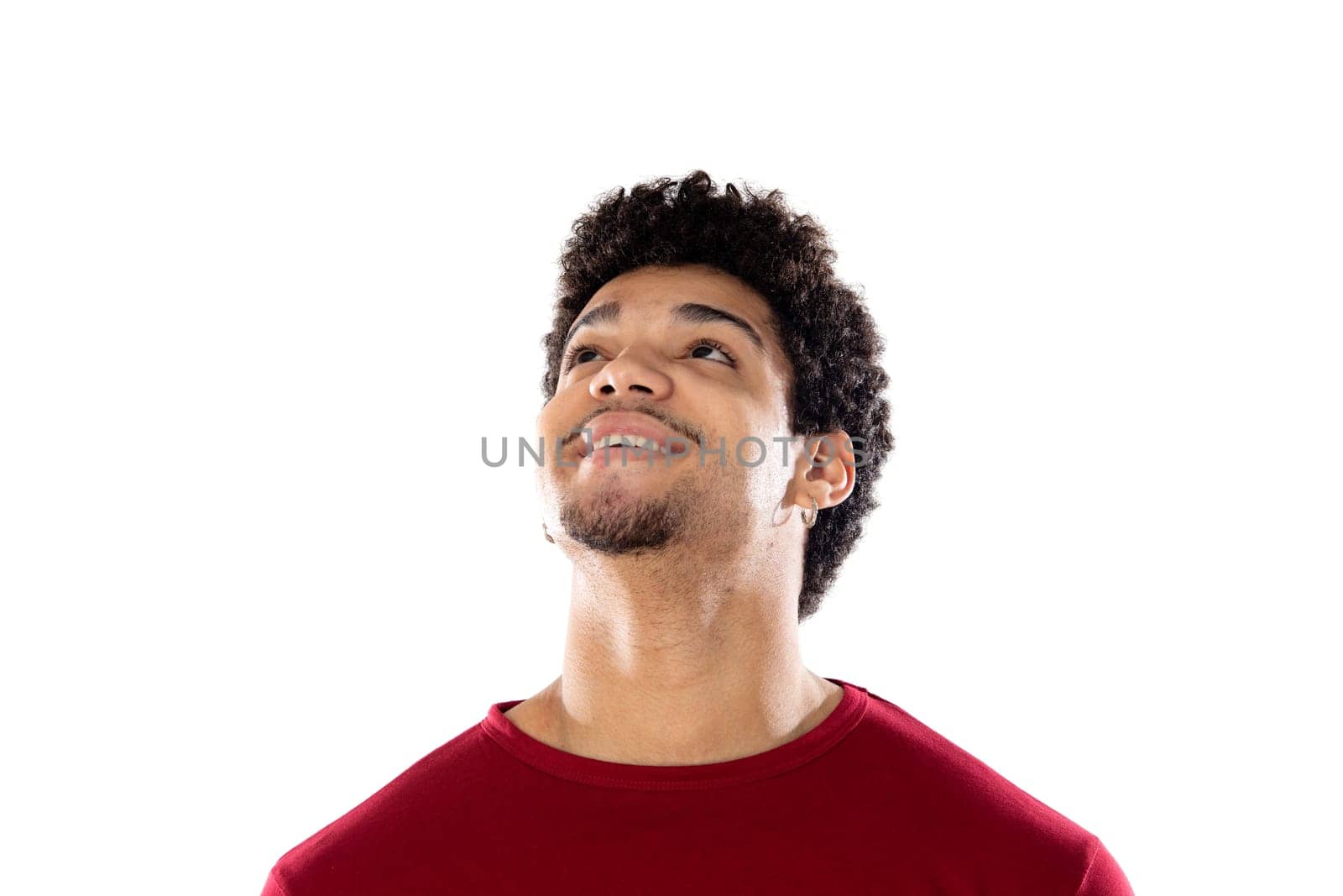 Cute african american man with afro hairstyle wearing a burgundy T-shirt isolated on a white background