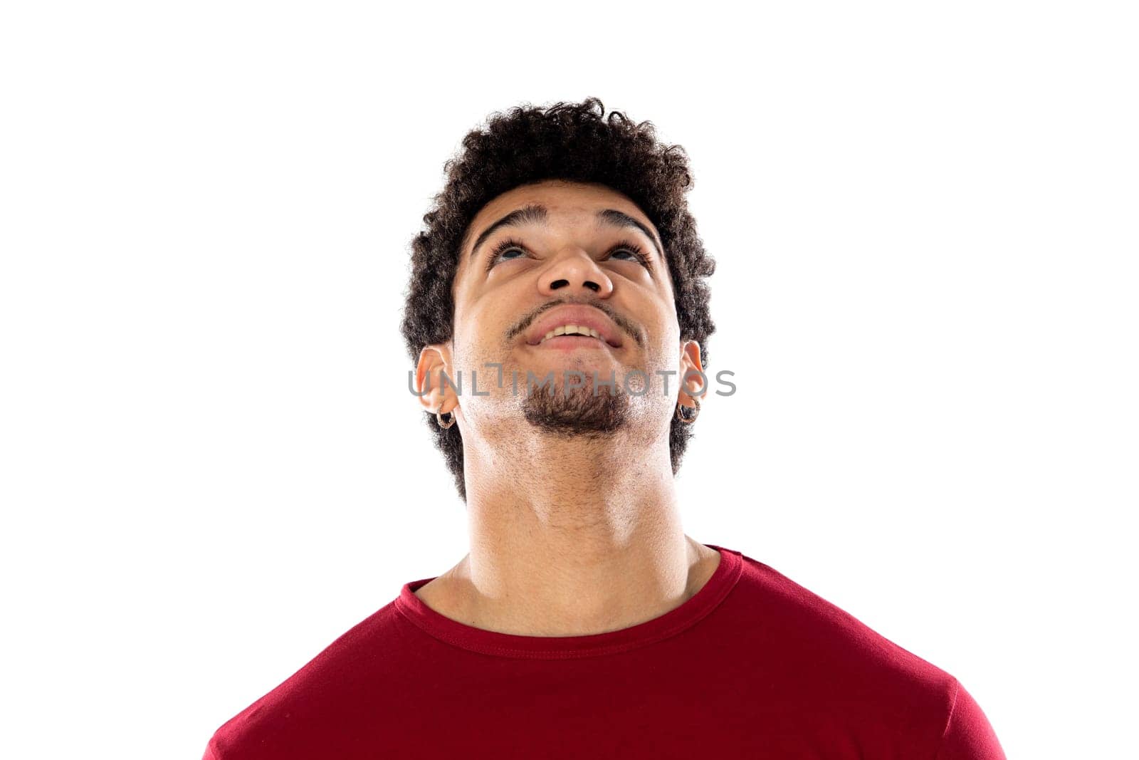 Cute african american man with afro hairstyle wearing a burgundy T-shirt isolated on a white background