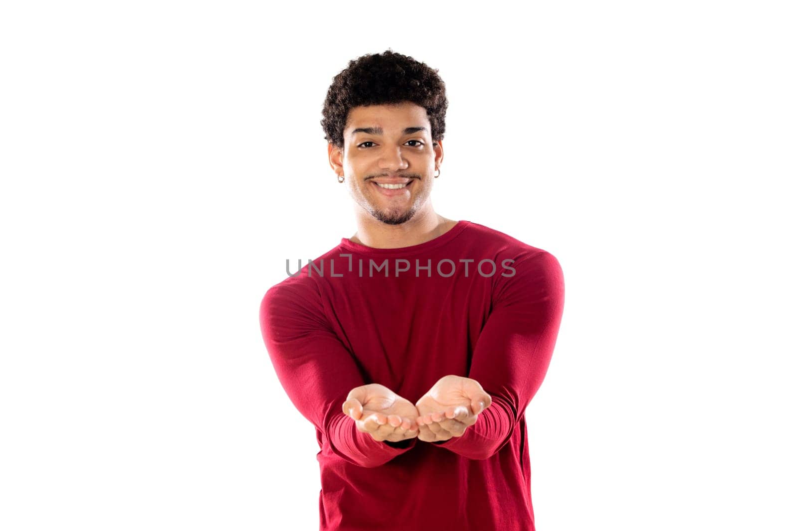 Cute african american man with afro hairstyle wearing a burgundy T-shirt isolated on a white background