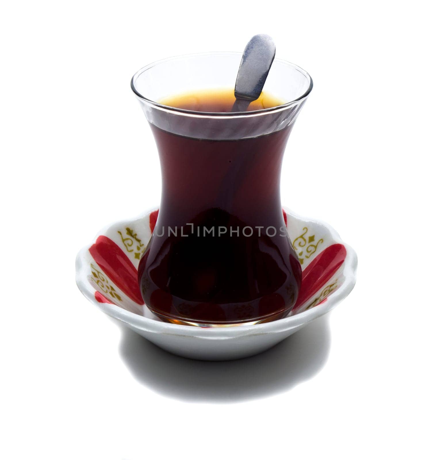 Brewed tea mixed with sugar spoon