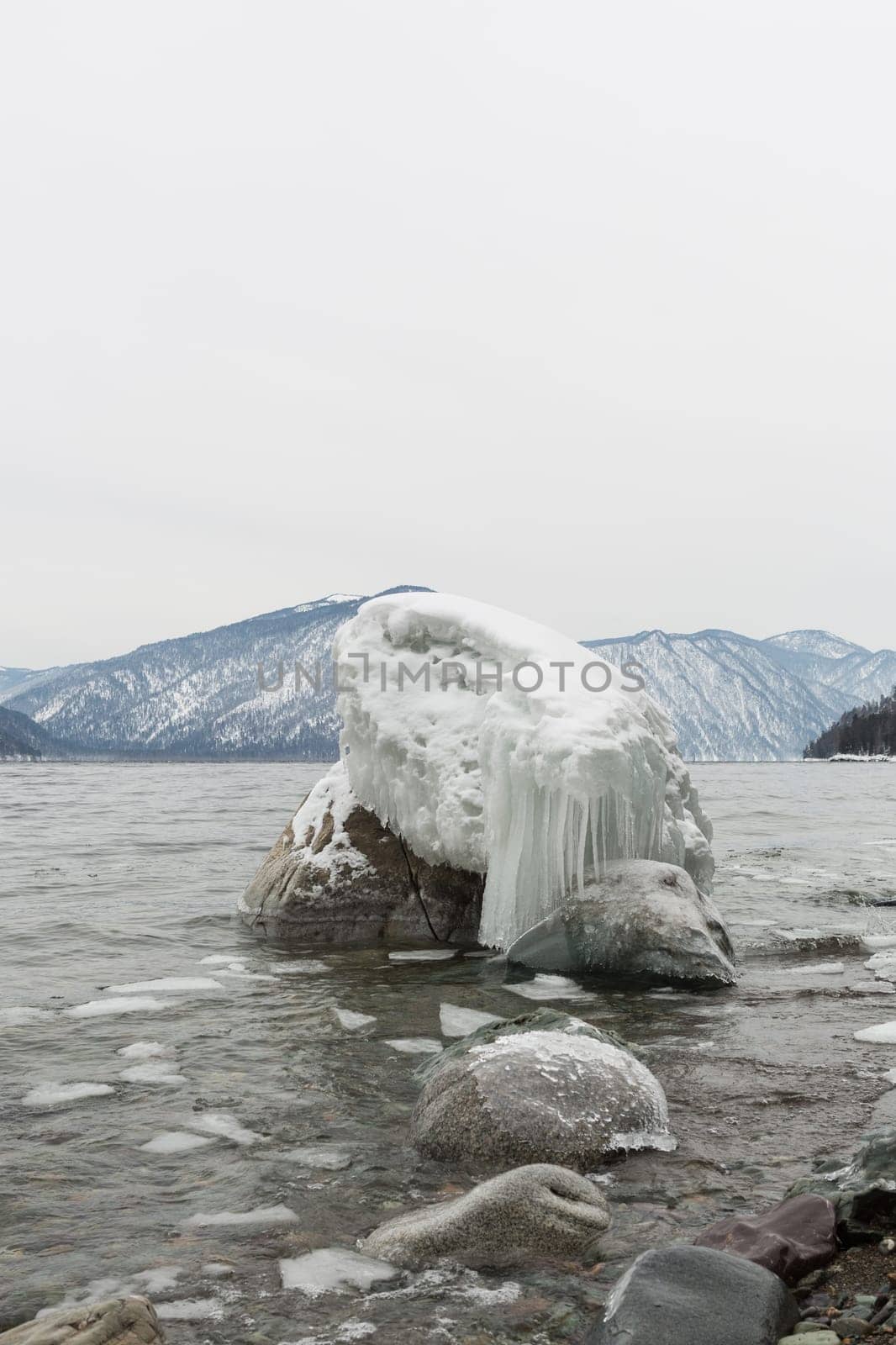 unfrozen Lake Teletskoye in winter. Russia Altai Krai.