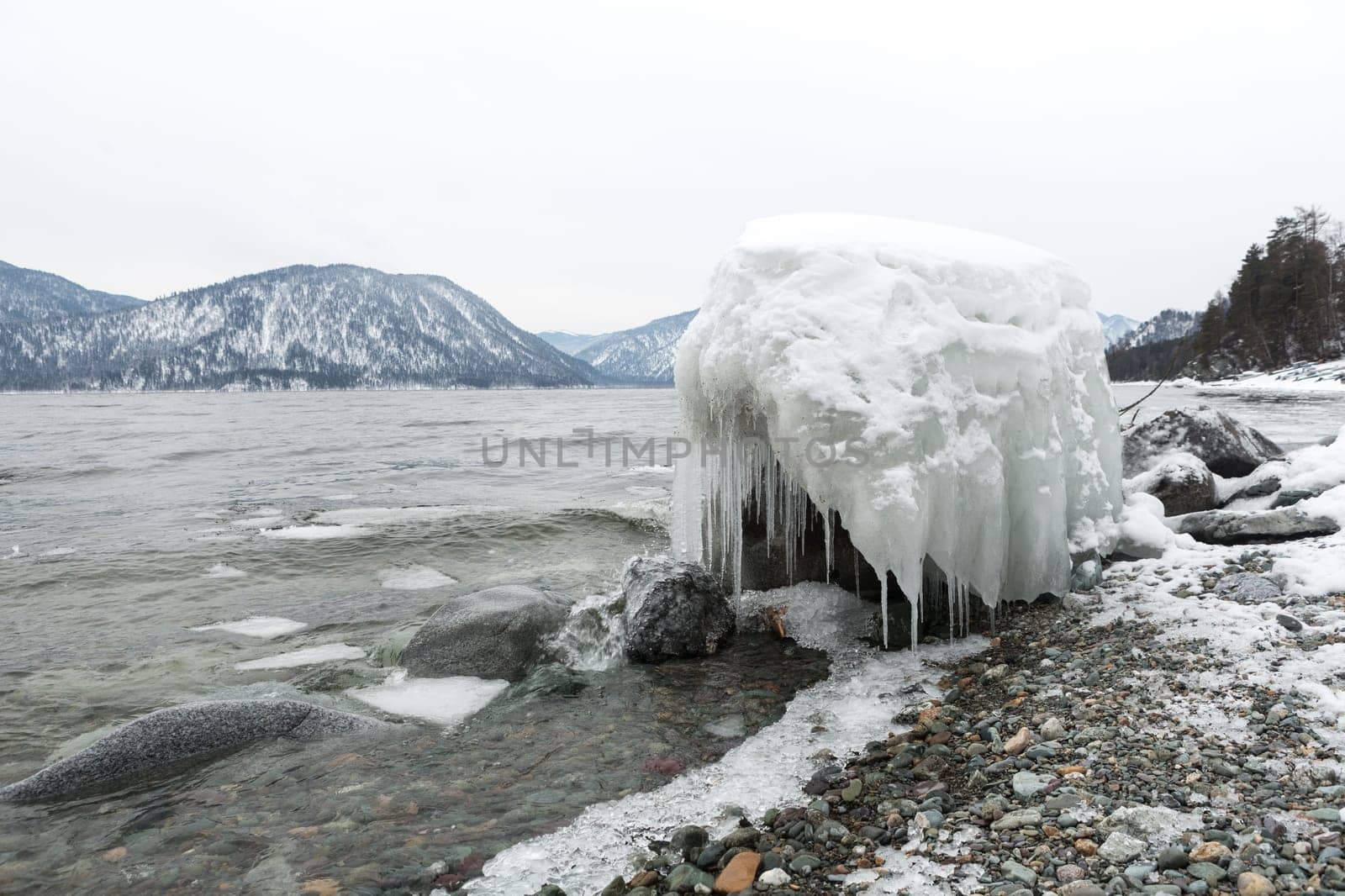 unfrozen Lake Teletskoye in winter. Russia Altai Krai.