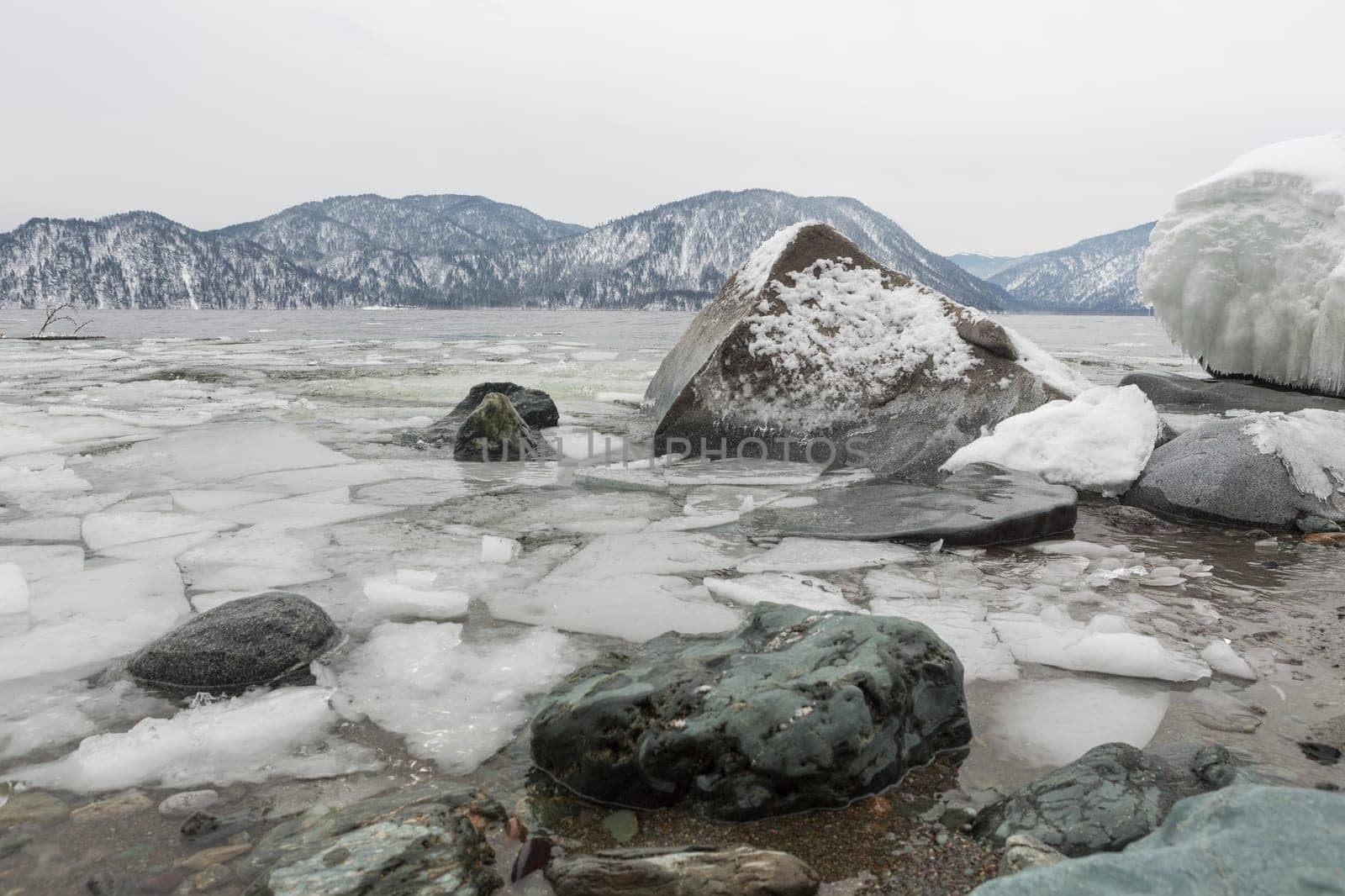 unfrozen Lake Teletskoye in winter. Russia Altai Krai.