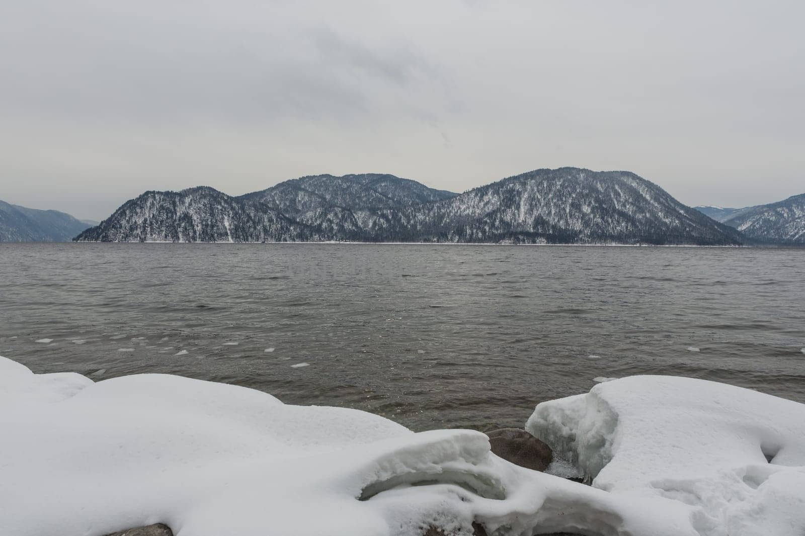 unfrozen Lake Teletskoye in winter. Russia Altai Krai.