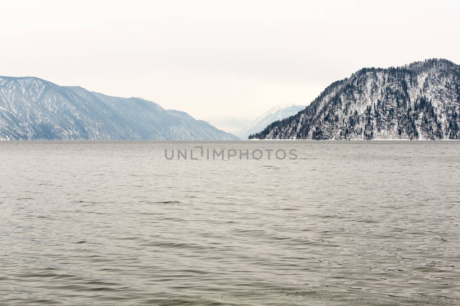 unfrozen Lake Teletskoye in winter. Russia Altai Krai.