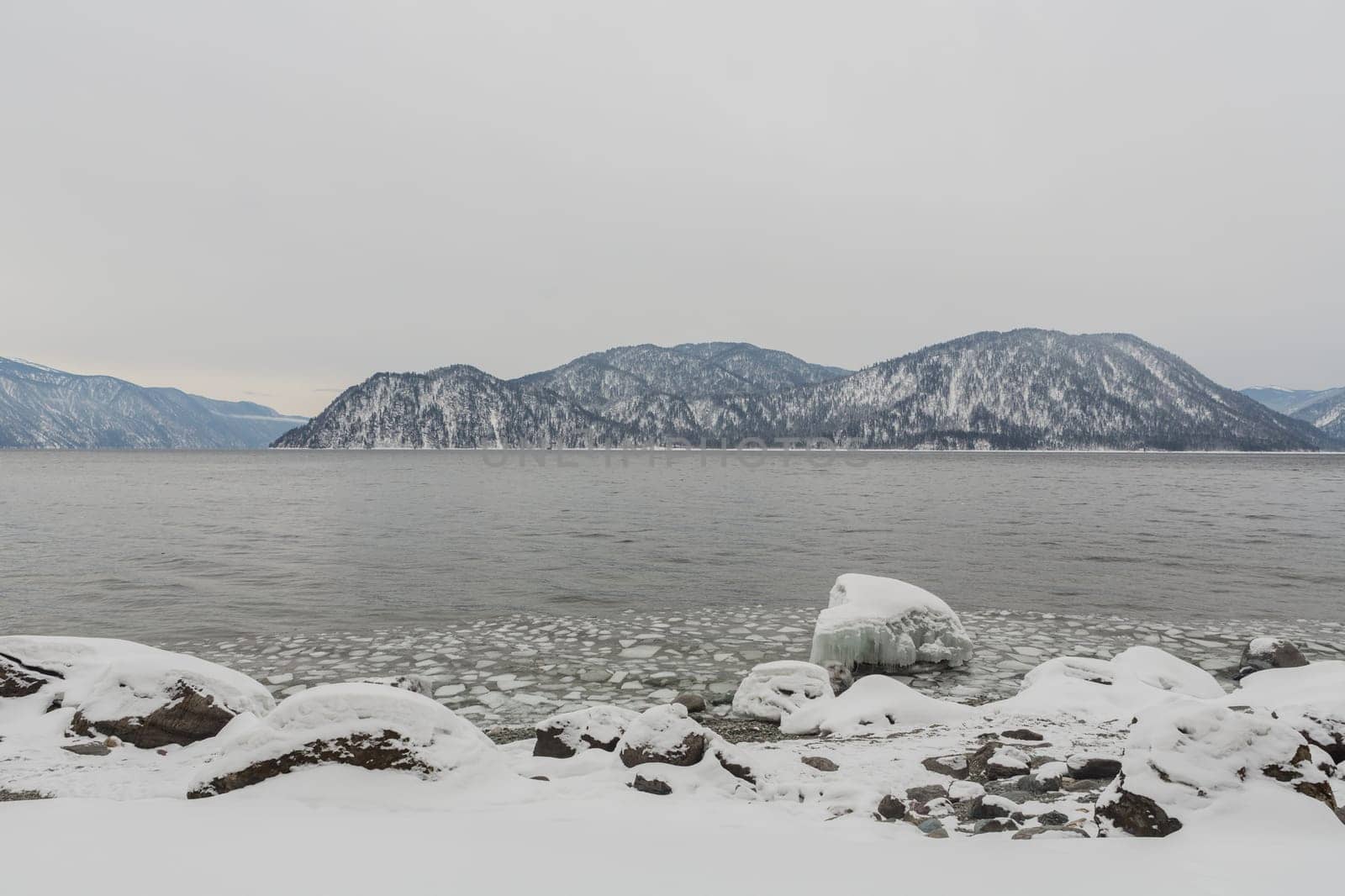 unfrozen Lake Teletskoye in winter. Russia Altai Krai.
