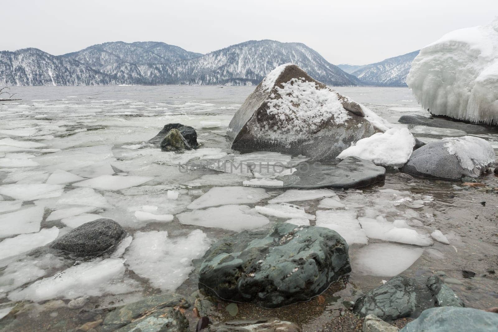 unfrozen Lake Teletskoye in winter. Russia Altai Krai.