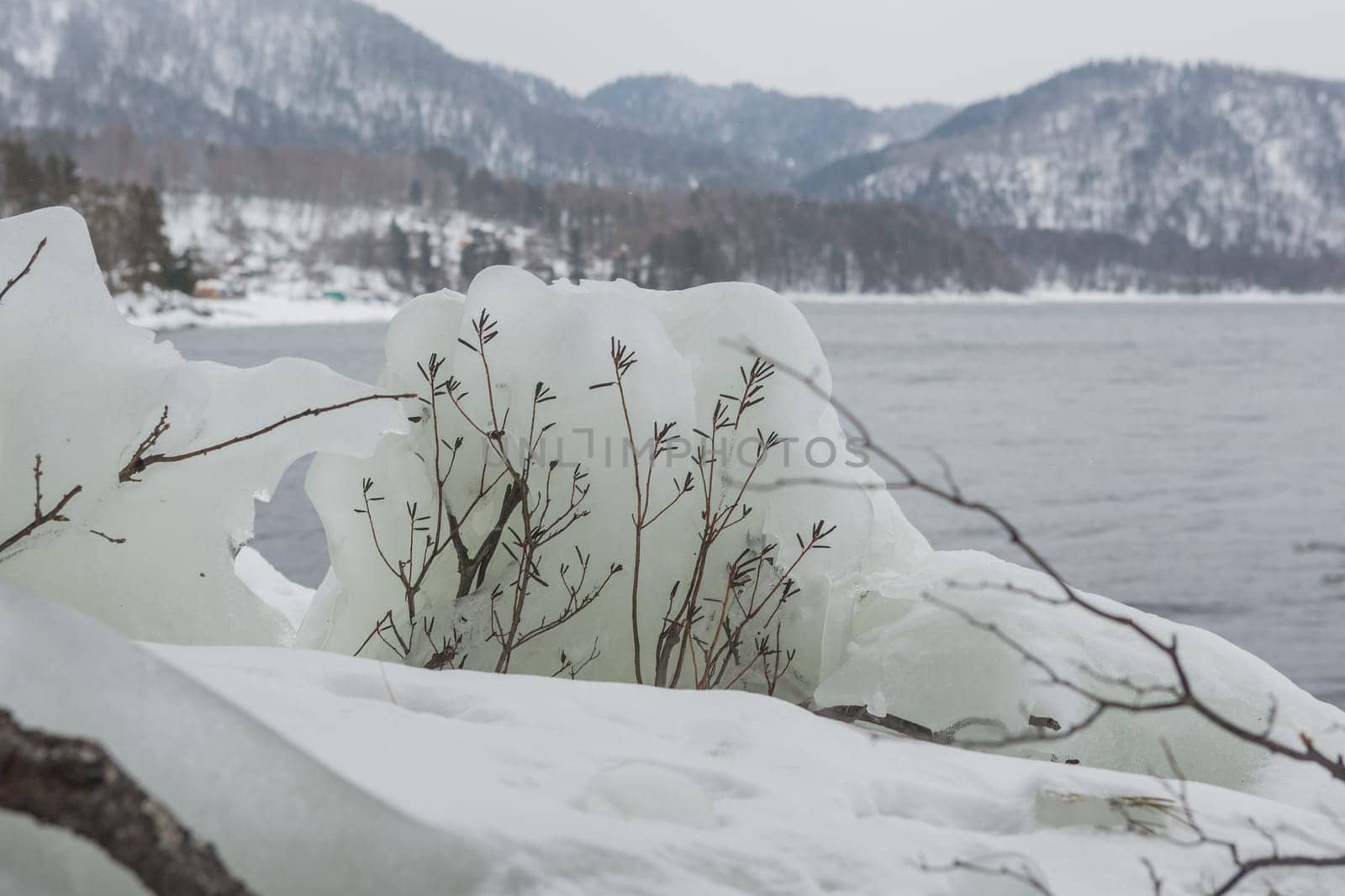 unfrozen Lake Teletskoye in winter. Russia Altai Krai.