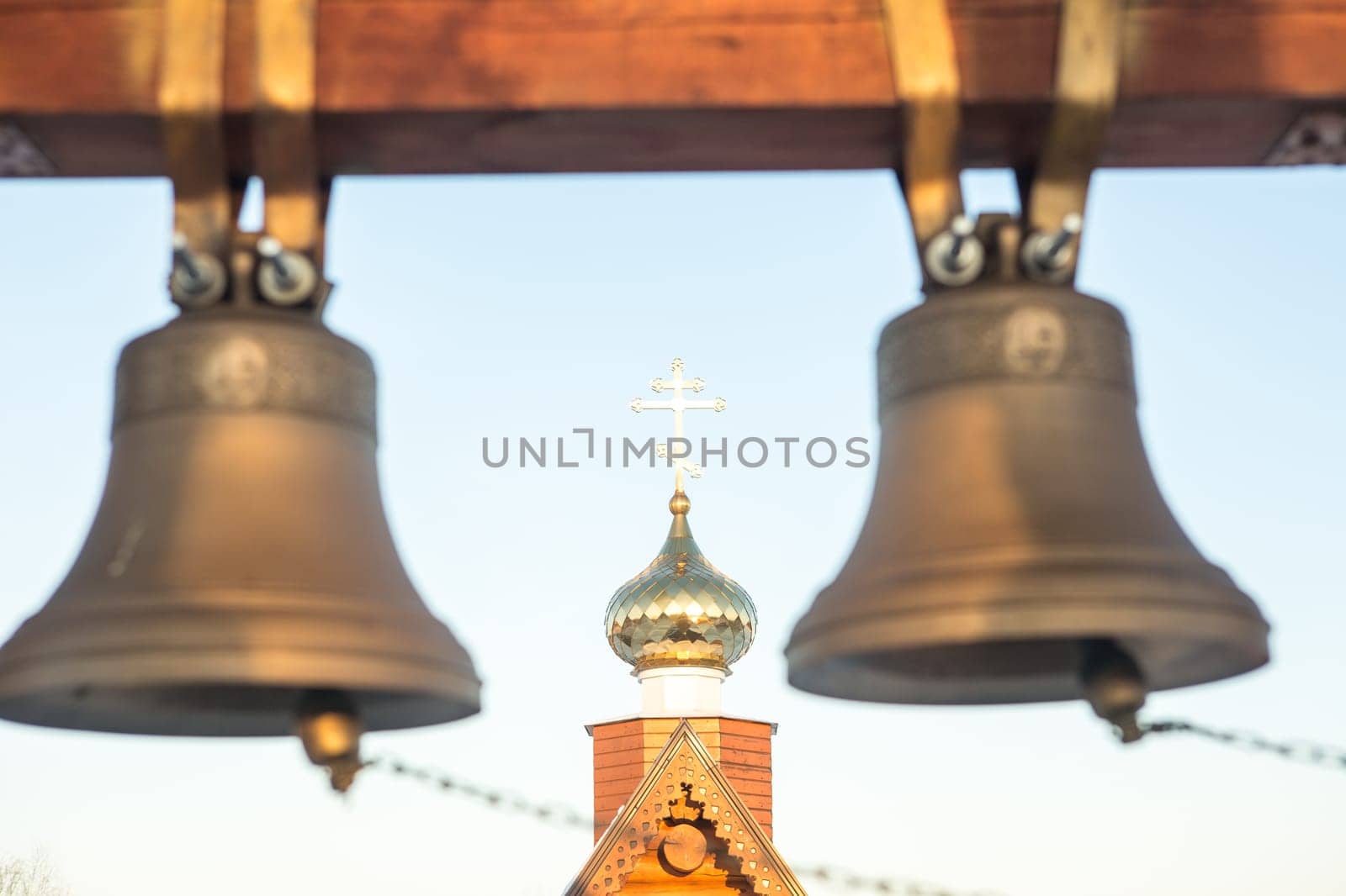 view of the bells and the dome of a small rural church in the village of Uval, Russia-Siberia.