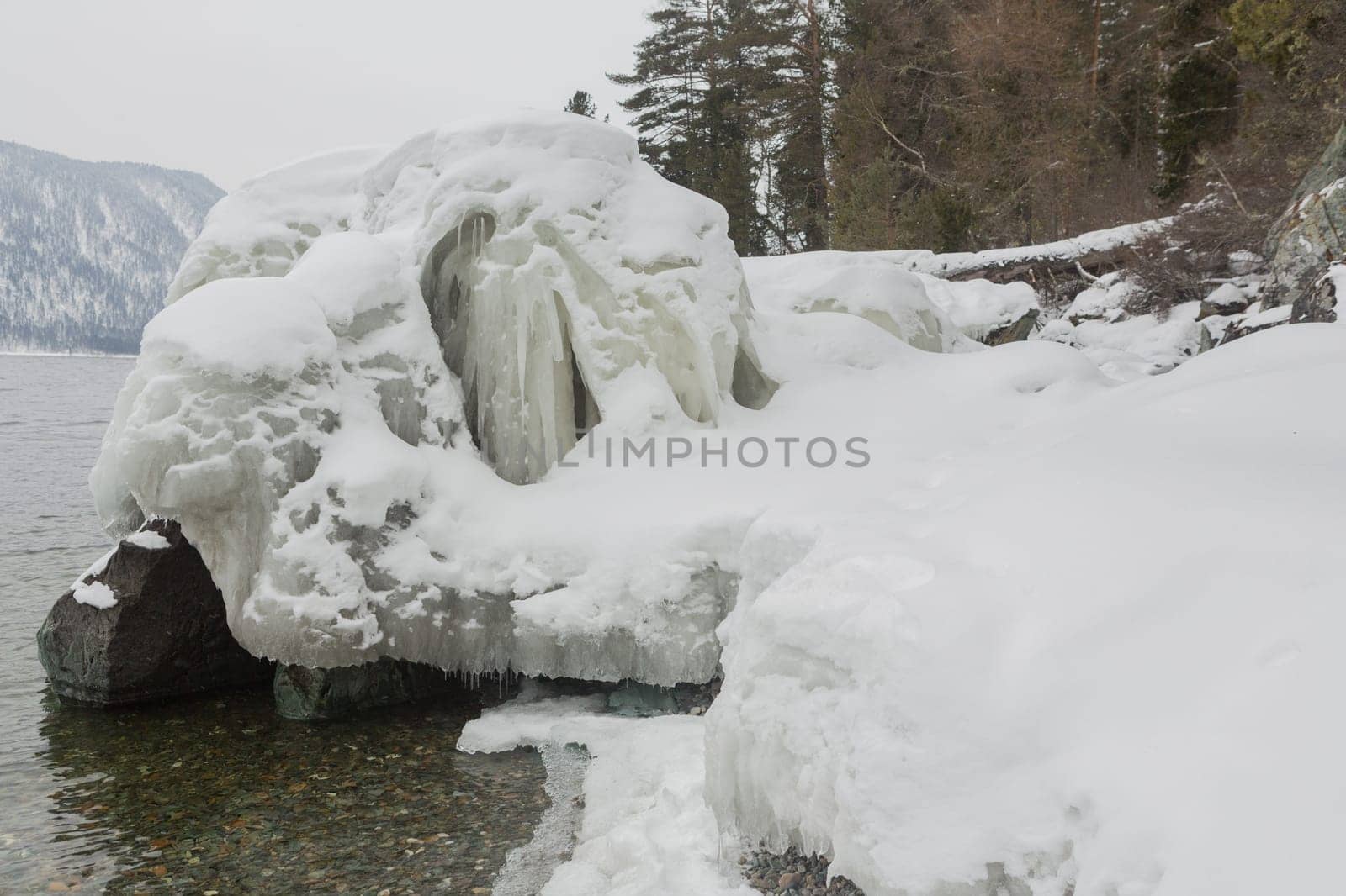 unfrozen Lake Teletskoye in winter. Russia Altai Krai.