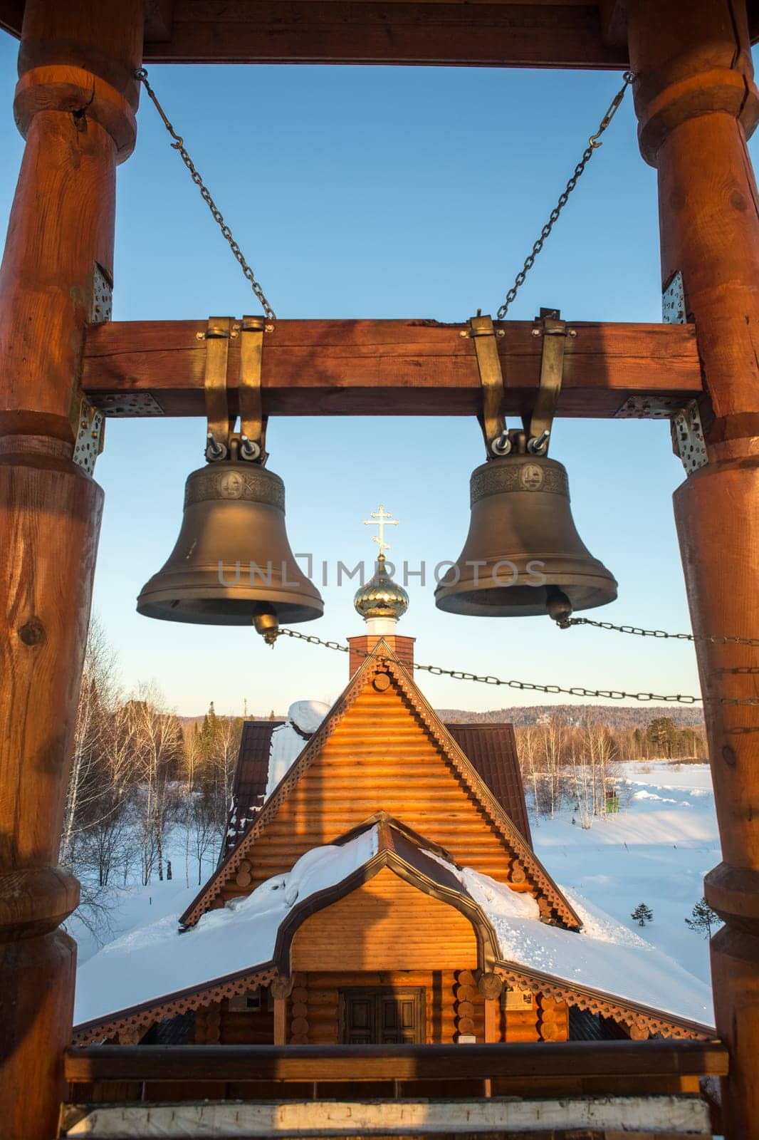 view of the bells and the dome of a small rural church in the village of Uval, Russia-Siberia.