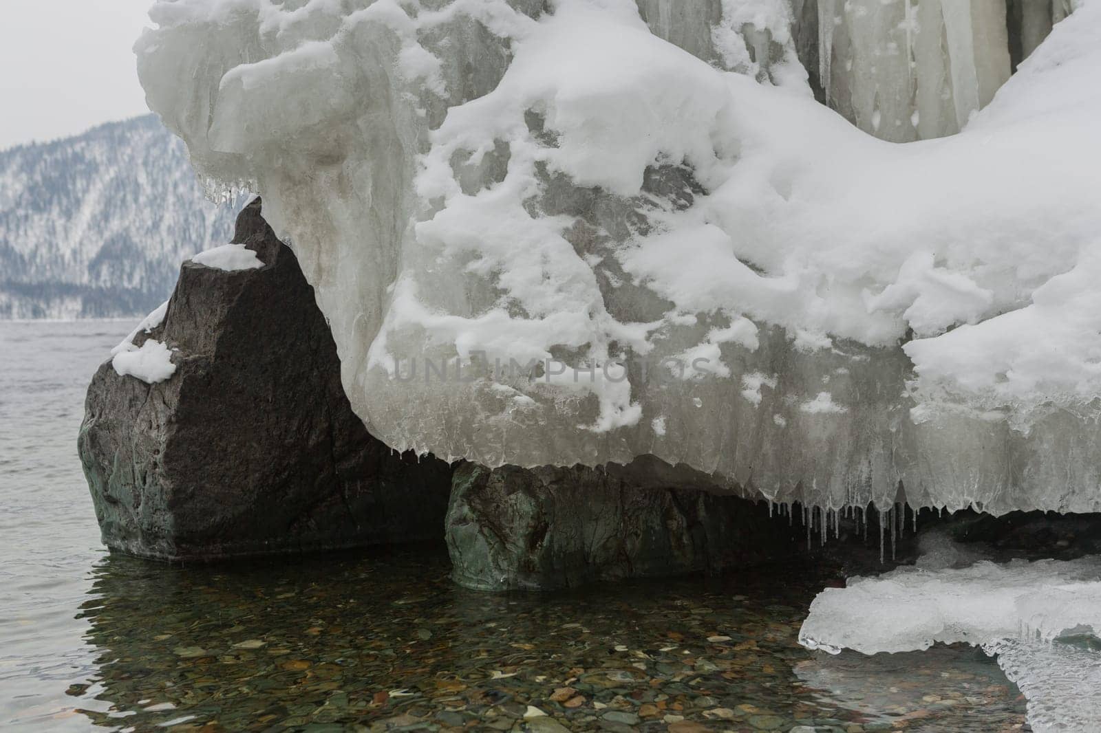 unfrozen Lake Teletskoye in winter. Russia Altai Krai.