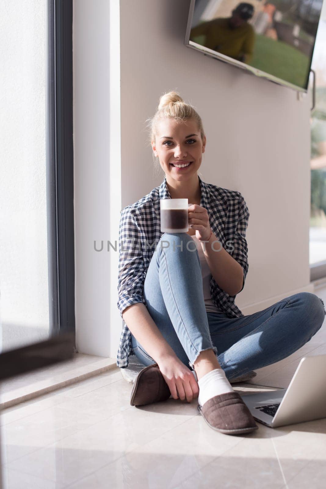 Real Woman Using laptop At Home on the floor Drinking Coffee Enjoying Relaxing