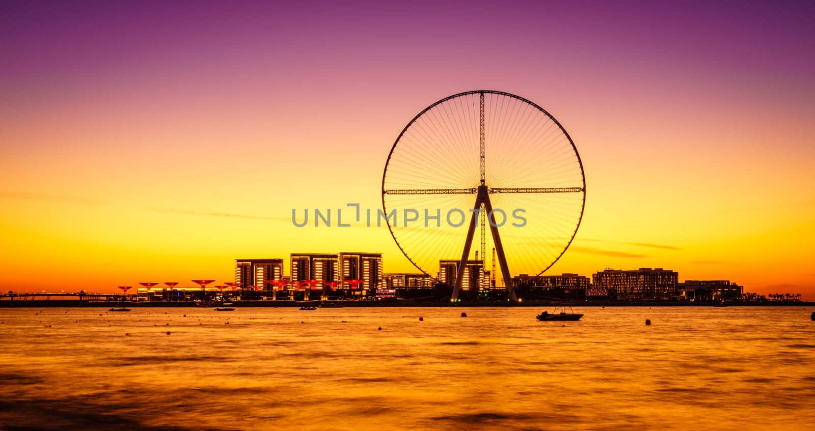 Twilight view of Bluewaters Island and Ain Dubai during construction, Dubai, UAE